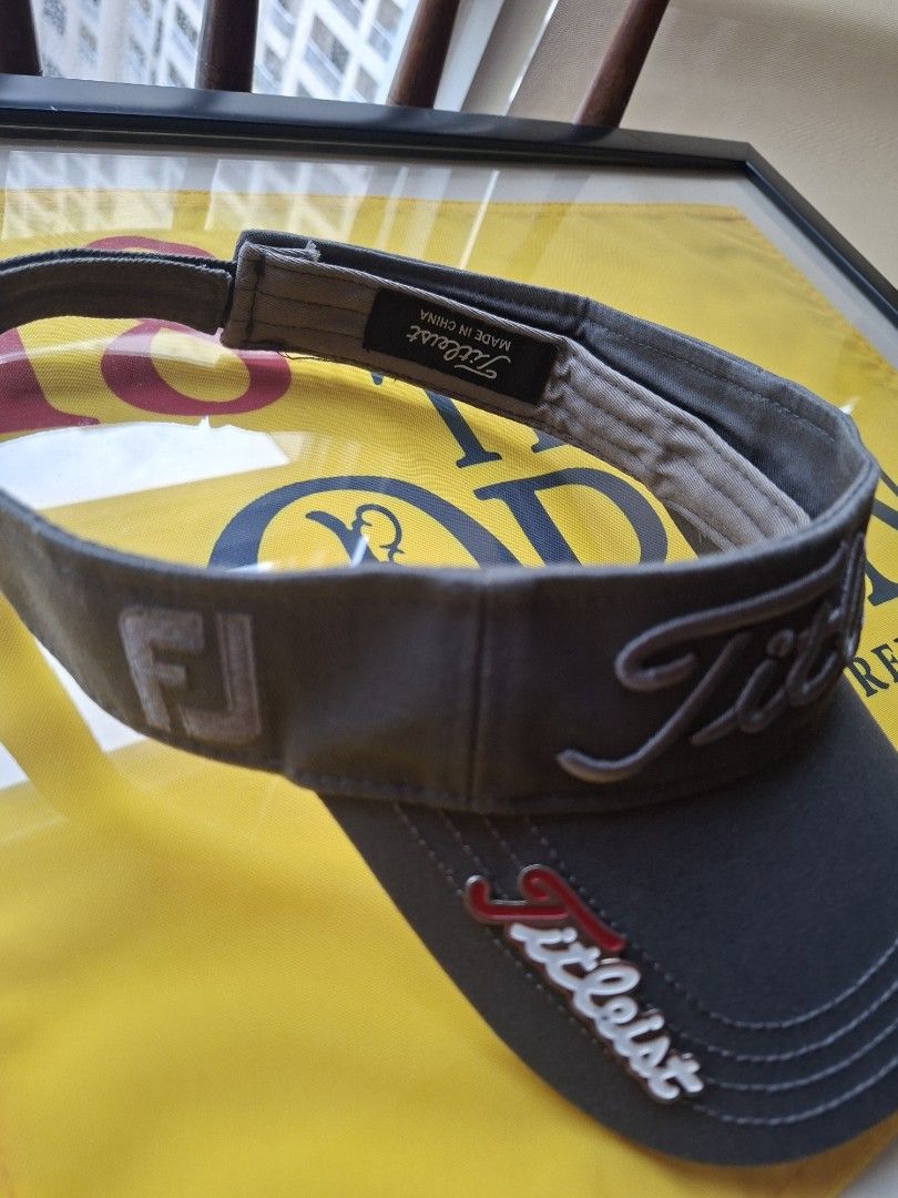 Titleist Golf Visor - Grey (Category: Golf) located in Makati City. Submitted by elmer.fudd (Listing ID 1451345797, Image 2). Description: - Grey Titleist golf visor - Embroidered logo on the front - Adjustable strap for a comfortable fit - with magnet for your ball marker .
