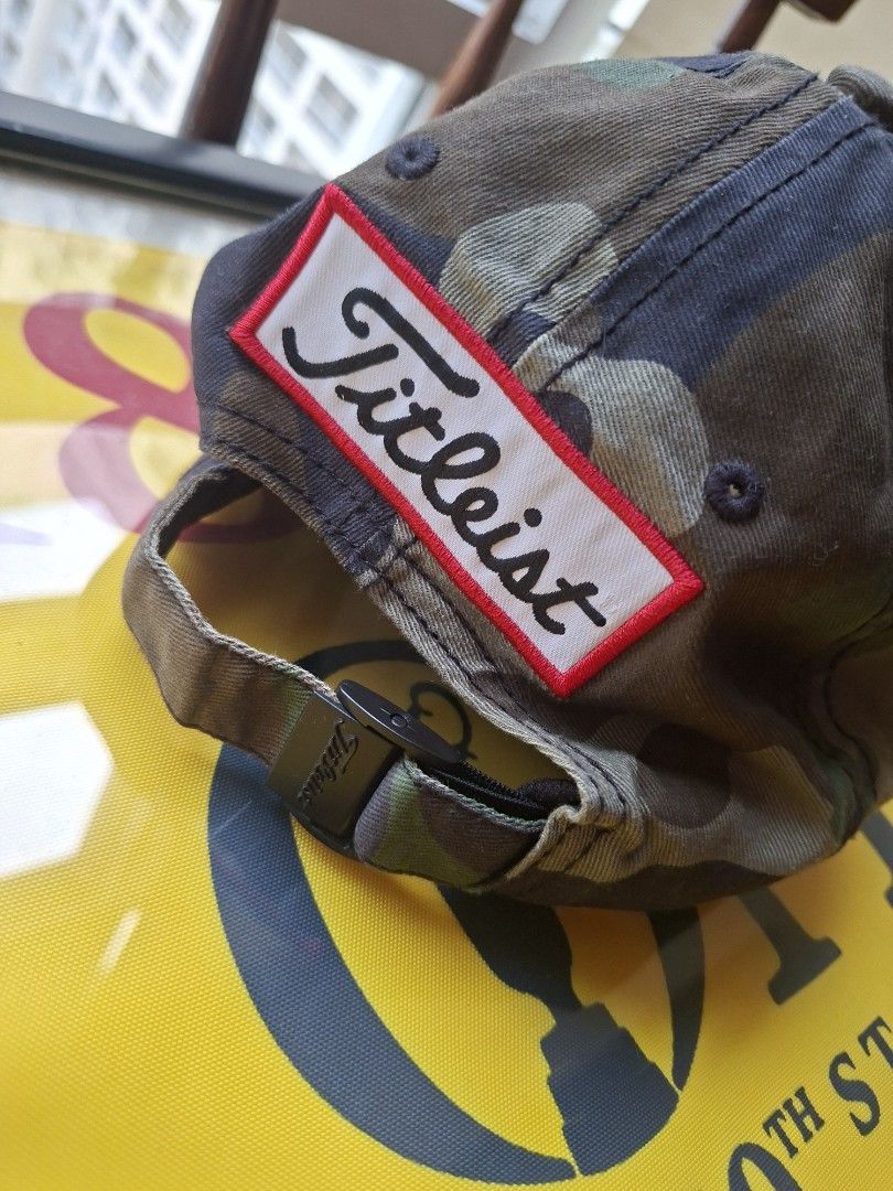 Titleist Pro V1 Camo Golf Cap (Category: Golf) located in Makati City. Submitted by elmer.fudd (Listing ID 1451345430, Image 3). Description: - Titleist Pro V1 golf cap - Stylish camouflage brim - White front panel - Embroidered Titleist logo on front and side - Adjustable strap for a custom fit - Ideal for golf or everyday wear.