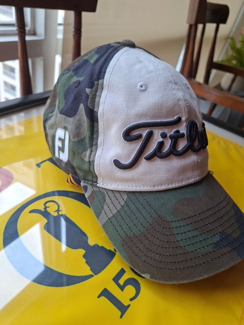 Titleist Pro V1 Camo Golf Cap (Category: Golf) located in Makati City. Submitted by elmer.fudd (Listing ID 1451345430, Image 2). Description: - Titleist Pro V1 golf cap - Stylish camouflage brim - White front panel - Embroidered Titleist logo on front and side - Adjustable strap for a custom fit - Ideal for golf or everyday wear.