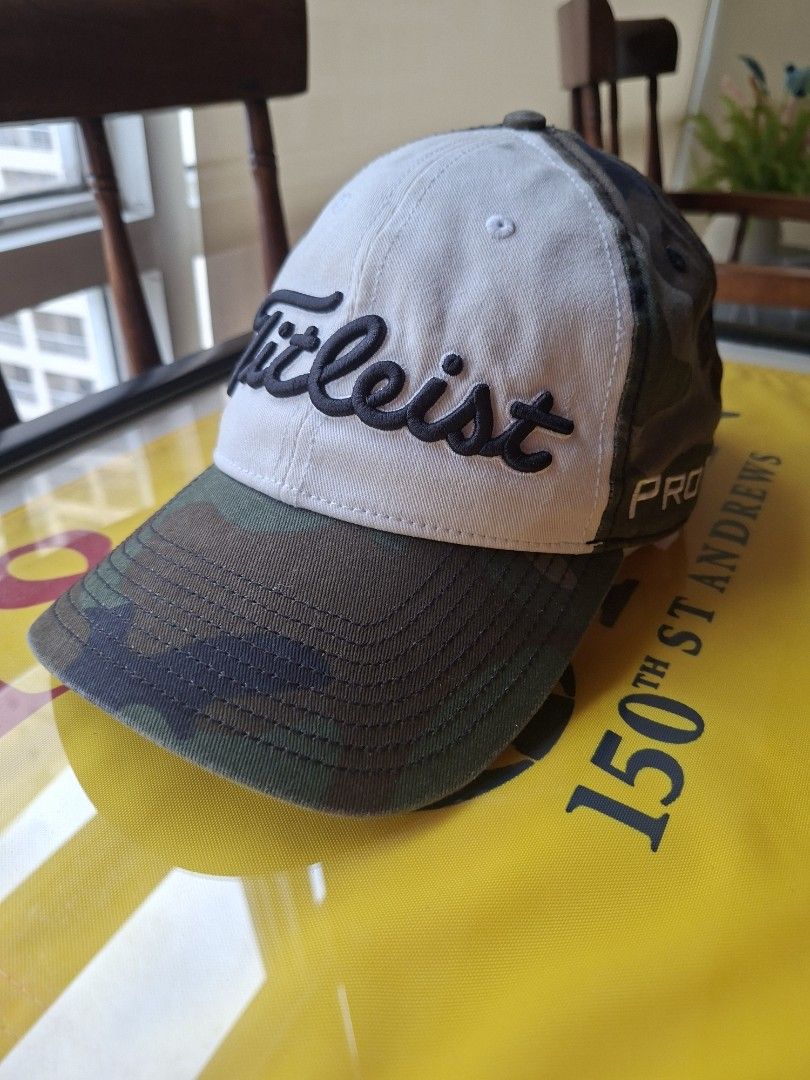Titleist Pro V1 Camo Golf Cap (Category: Golf) located in Makati City. Submitted by elmer.fudd (Listing ID 1451345430, Image 1). Description: - Titleist Pro V1 golf cap - Stylish camouflage brim - White front panel - Embroidered Titleist logo on front and side - Adjustable strap for a custom fit - Ideal for golf or everyday wear.