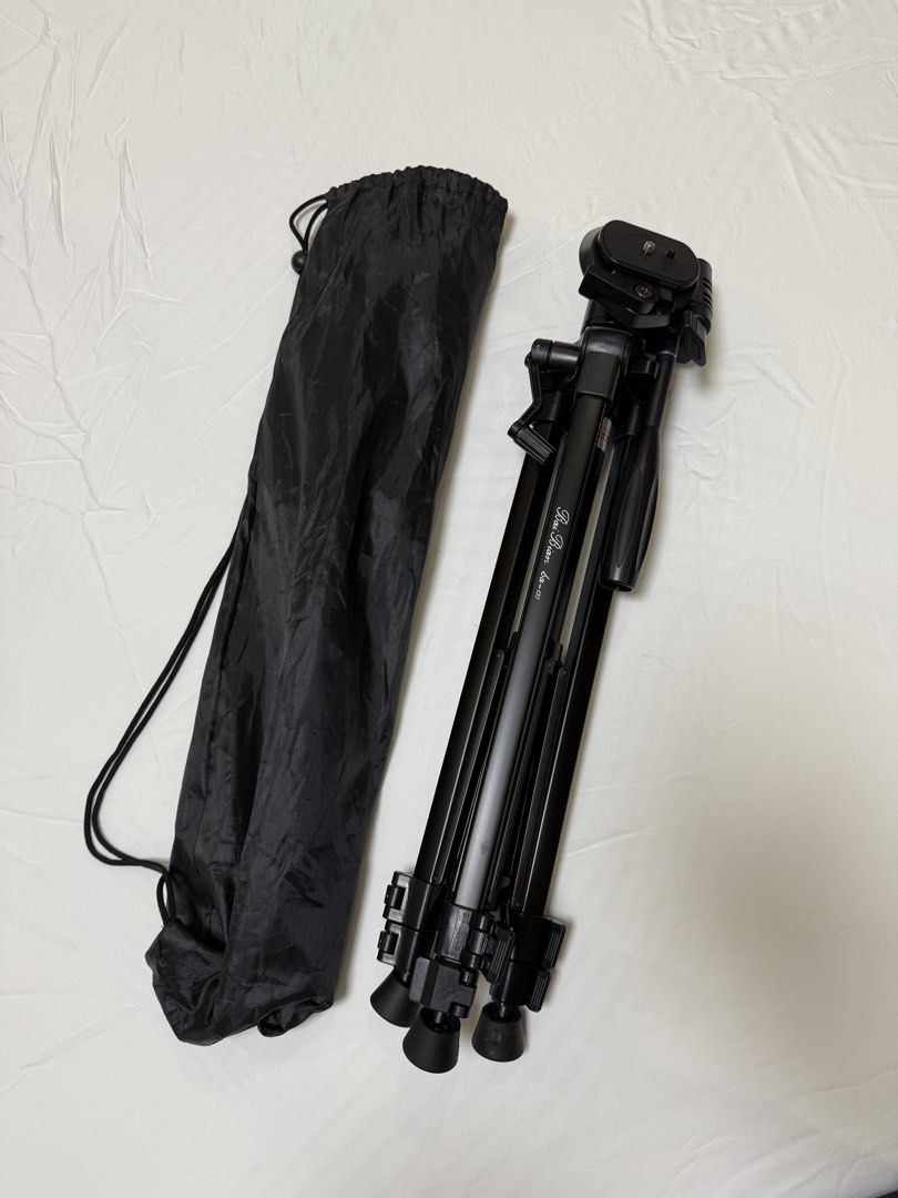 Tripod Camera Stand (Compatible with any camera with screw on bottom) (Category: Camera Bags & Carriers) located in Manila. Submitted by aruariane (Listing ID 1451362831, Image 1). Description: For my fujifilm sana but never got to use it or take it out .