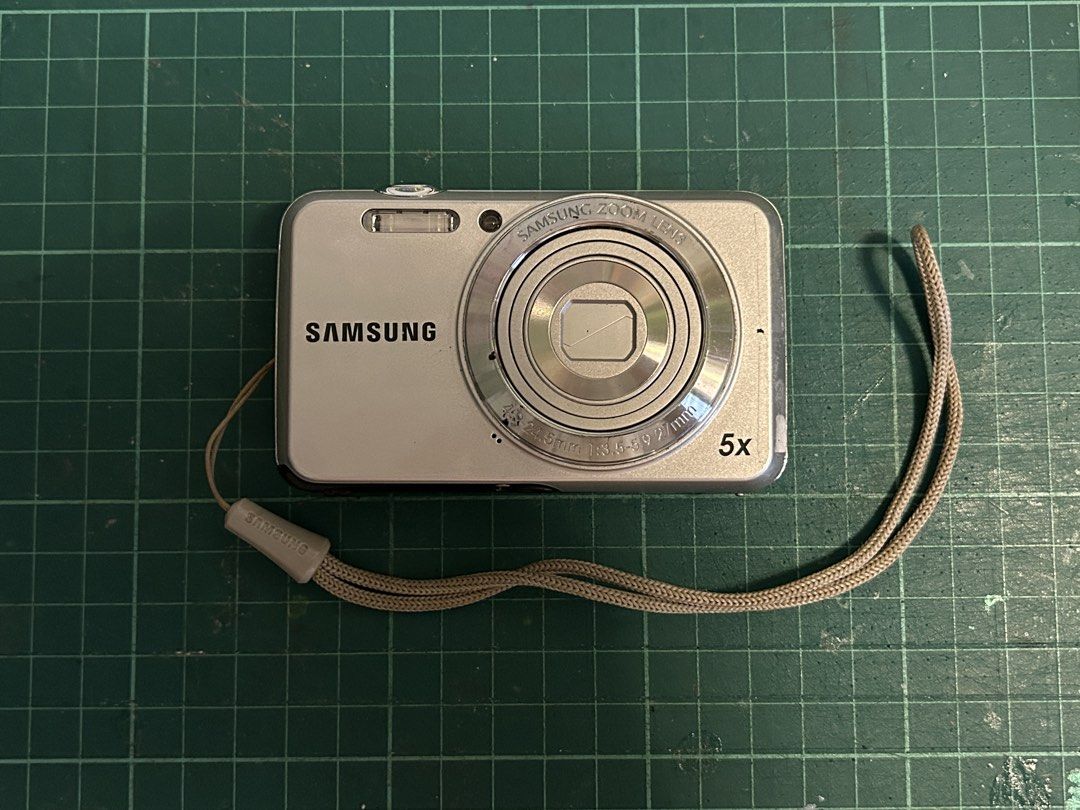 [UNTESTED] Digital Camera 📸 Samsung ES80 (Silver) (Category: Cameras) located in Manila. Submitted by gamityen (Listing ID 1451373712, Image 2). Description: TWO AVAILABLE - Samsung ES80 Digital Camera - 12.0 Megapixels - 5x Optical Zoom - Includes Wrist Strap and Bag - Battery NOT included - SD Card NOT included ⚠️ PLEASE READ BEFORE BUYING Condition: - Untested; unsure if working - Average cosmetic condition (7/10) - Has some black marks (see 