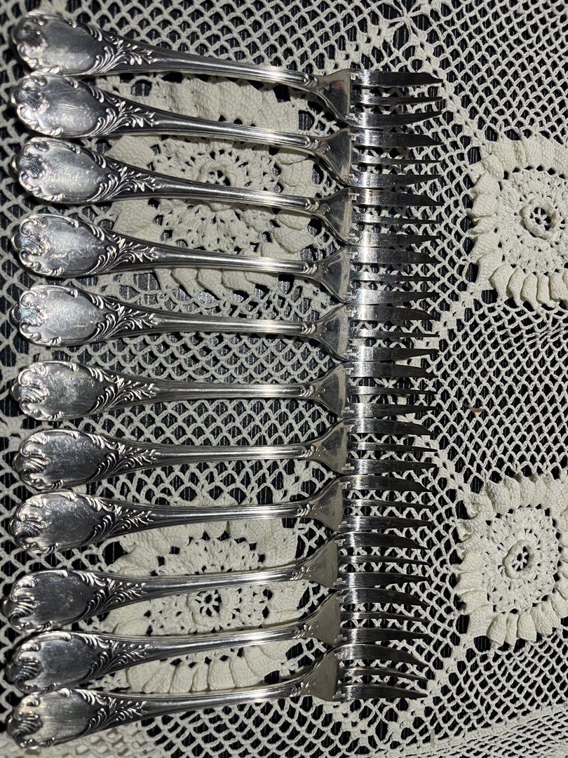 Vintage Silver Plated Dessert Spoons and Forks Set (Category: Dinnerware & Cutlery) located in Manila. Submitted by edrian1.60dd9c (Listing ID 1451492005, Image 1). Description: - Set of 11 dessert spoons and 11 dessert forks - Beautiful ornate handle design - Made of silver plate - Ideal for special occasions or adding a vintage touch - Minor signs of wear consistent with age.