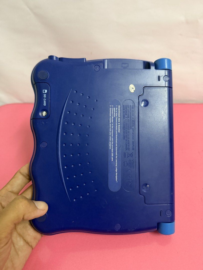 VTech v.reader Interactive Learning System with Games (Category: Educational & Learning Toys) located in Kuala Lumpur. Submitted by kunantikan (Listing ID 1451357857, Image 3). Description: - VTech V.Reader learning system - Includes main unit and one game cartridge - Features a screen and keyboard - Back has an SD card slot - Ideal for interactive learning and fun - free postage - self collect /cod klang.