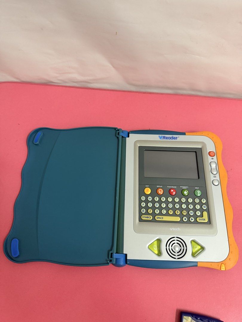 VTech v.reader Interactive Learning System with Games (Category: Educational & Learning Toys) located in Kuala Lumpur. Submitted by kunantikan (Listing ID 1451357857, Image 2). Description: - VTech V.Reader learning system - Includes main unit and one game cartridge - Features a screen and keyboard - Back has an SD card slot - Ideal for interactive learning and fun - free postage - self collect /cod klang.