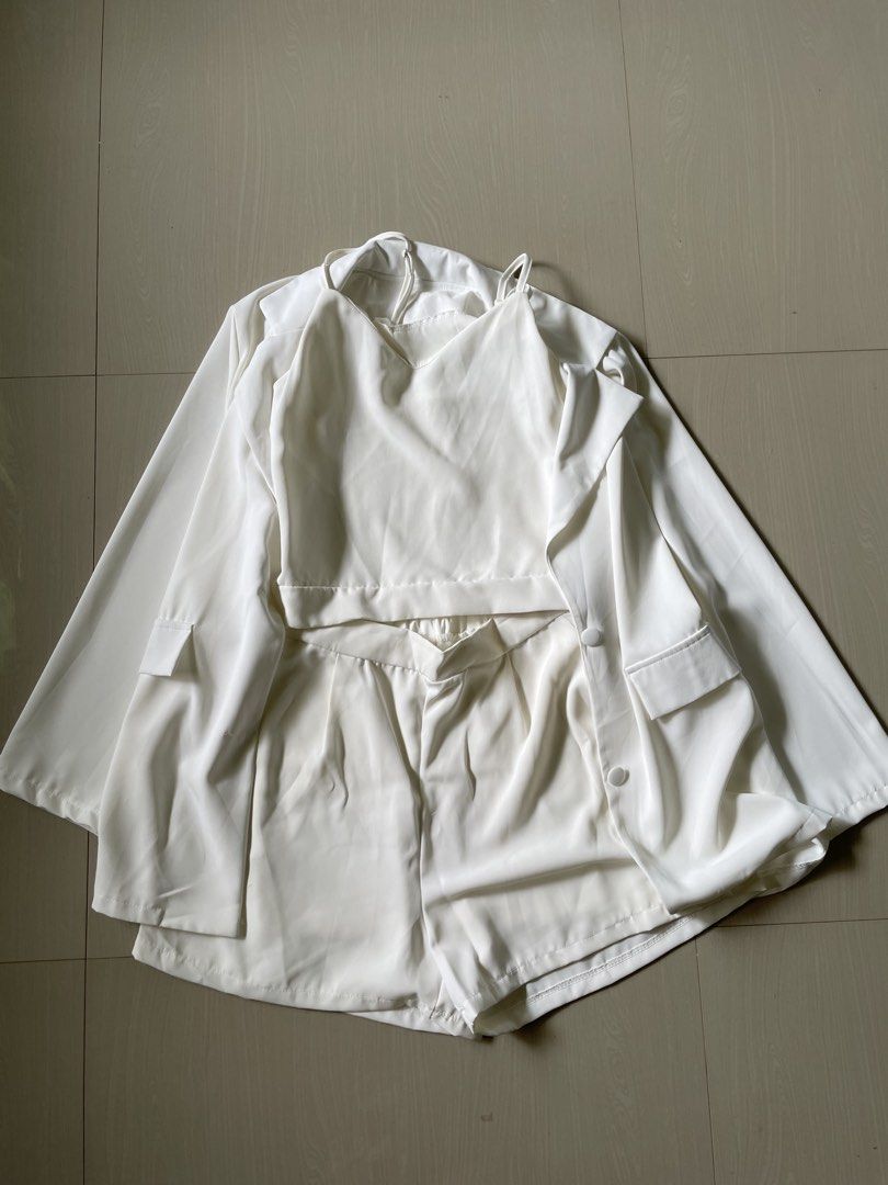 White Blazer and Shorts Set with Camisole (Category: Sets or Coordinates) located in Pasuquin. Submitted by licashop.ph (Listing ID 1451366301, Image 3). Description: - Complete 3-piece white suit set - Includes: Blazer, Camisole, Tailored Shorts -never been used -bought in the mall - Versatile: Ideal for smart casual or formal occasions - Perfect for summer: Lightweight and breathable fabric - Blazer features: Two-button closure, functional pock