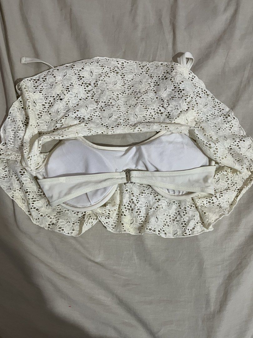 White Lace Bikini Top with Tie Straps (Category: Bikinis & Swimsuits) located in Manila. Submitted by mxinii (Listing ID 1451430848, Image 3). Description: - Cute white lace bikini top - Features a ruffled hemline - Ties at the shoulders and back for adjustable fit - Built-in bra cups for support - Ideal for beach or pool days - Chic and summery style.