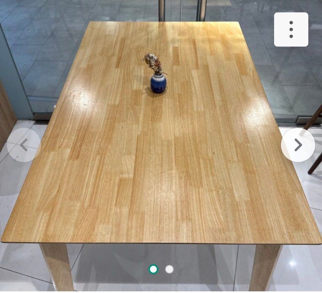Solid Wood Dining Table (Category: Tables & Sets) located in Singapore. Submitted by vanillamangalica (Listing ID 1451429478, Image 2). Description: - Solid wood dining table - Natural wood grain finish - Seats 4 people comfortably - Ideal for small spaces & apartments - Sturdy, well-attached legs - Easy to clean surface - Selling due to relocation.