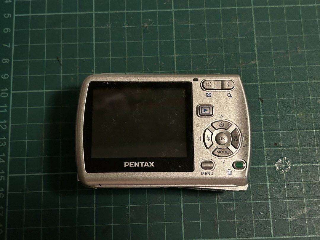 [WORKING] Digital Camera 📸 Pentax Optio E30 (Silver) (Category: Cameras) located in Manila. Submitted by gamityen (Listing ID 1451378765, Image 3). Description: - Pentax Optio E30 Digital Camera - 7.1 Megapixels - 3x Optical Zoom - Includes pink camera case - Battery NOT included - SD Card NOT included Bought for 3,900 Selling for 2,500 ⚠️ PLEASE READ BEFORE BUYING Condition: - Broken battery latch; can’t close properly (see photos) - Shutter wo