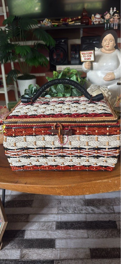 Woven Basket Box with Handle and Red Lining (Category: Storage Boxes & Baskets) located in Cainta. Submitted by ulikebag (Listing ID 1451390289, Image 1). Description: Vintage Woven Picnic Basket 🧺🤍 Base 8” x width 11” x H 7” Beautiful vintage woven picnic basket in excellent pre-loved condition. Features a sturdy handle, secure clasp closure, and a unique multicolor woven design that adds a charming rustic touch. Perfect for picnics, home déco