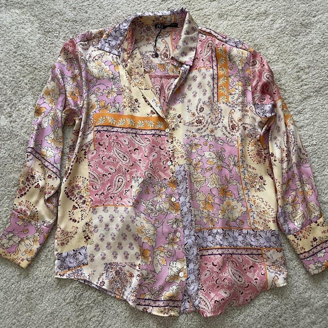 ZARA Patchwork Print Long Sleeve Shirt (Category: Tshirts & Polo Shirts ) located in Quezon City. Submitted by dcltrrr8 (Listing ID 1451411880, Image 1). Description: - ZARA shirt with a vibrant, colorful patchwork print. - Features long sleeves and a classic button-up design. - Made from a smooth, satin-like fabric. - Perfect for dressing up or down, offering great versatility. - Size Medium (M)..