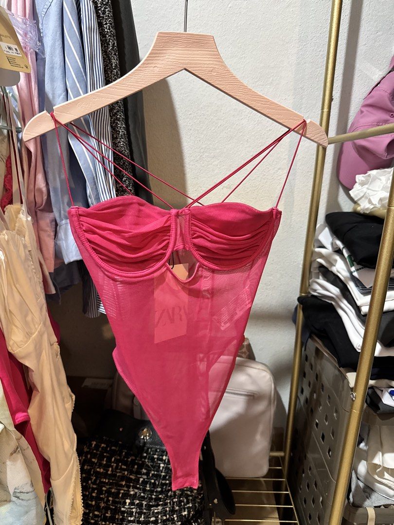 Zara Pink Mesh Corset Bodysuit (Category: Others Tops) located in Bacolod City. Submitted by usedbyc (Listing ID 1451326387, Image 1). Description: - Hot pink mesh bodysuit from Zara - Corset-style bust with ruched detailing - Strappy design with crisscrossing back straps - Versatile for layering or wearing solo - Brand new with original tags attached.