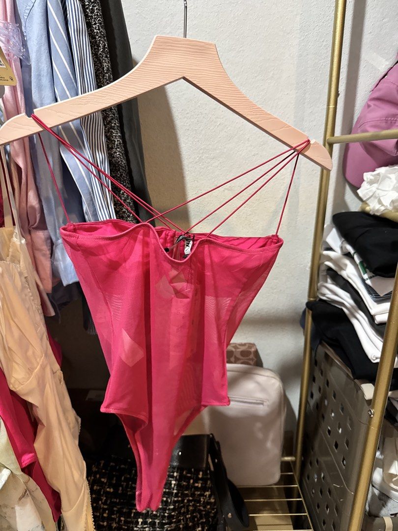 Zara Pink Mesh Corset Bodysuit (Category: Others Tops) located in Bacolod City. Submitted by usedbyc (Listing ID 1451326387, Image 2). Description: - Hot pink mesh bodysuit from Zara - Corset-style bust with ruched detailing - Strappy design with crisscrossing back straps - Versatile for layering or wearing solo - Brand new with original tags attached.