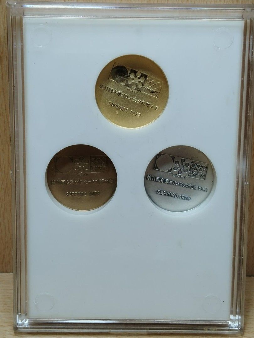 1972 Sapporo Winter Olympics Commemorative Medals Set (Category: Currency) located in Davao. Submitted by washerjeni08452 (Listing ID 1451597580, Image 2). Description: - Set of three commemorative medals from the XI Olympic Winter Games, Sapporo 1972. - Includes gold, silver, and bronze EP medals. - Features the official Sapporo '72 logo and Olympic rings. - Comes in a protective display case. - Ideal for collectors of Olympic memorabilia. Selli