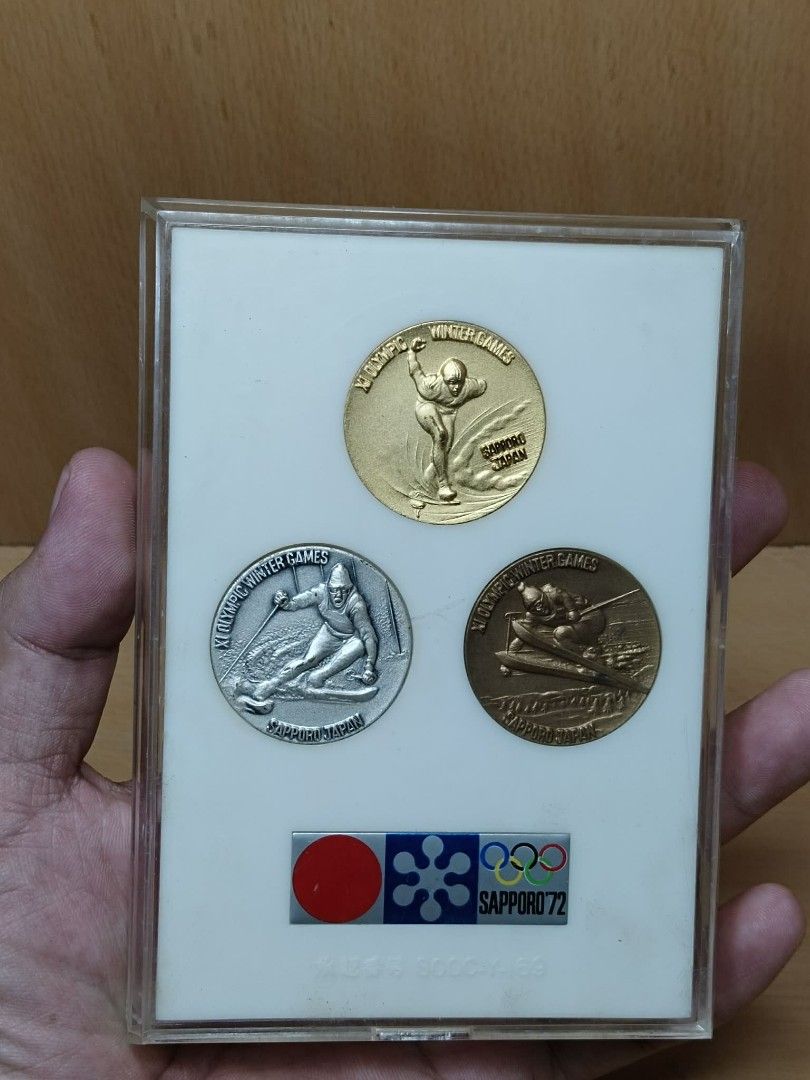 1972 Sapporo Winter Olympics Commemorative Medals Set (Category: Currency) located in Davao. Submitted by washerjeni08452 (Listing ID 1451597580, Image 3). Description: - Set of three commemorative medals from the XI Olympic Winter Games, Sapporo 1972. - Includes gold, silver, and bronze EP medals. - Features the official Sapporo '72 logo and Olympic rings. - Comes in a protective display case. - Ideal for collectors of Olympic memorabilia. Selli