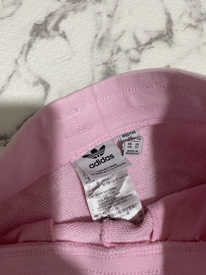 Adidas Pink Shorts with White Stripes (Category: Babies & Kids Fashion) located in Valenzuela. Submitted by acandychin (Listing ID 1451697972, Image 2). Description: - Pink Adidas shorts for kids - Classic white stripes on the sides - Drawstring waist for a comfortable fit - Adidas logo on the leg - Made from a soft cotton blend - Ideal for playtime and lounging 4-5y.