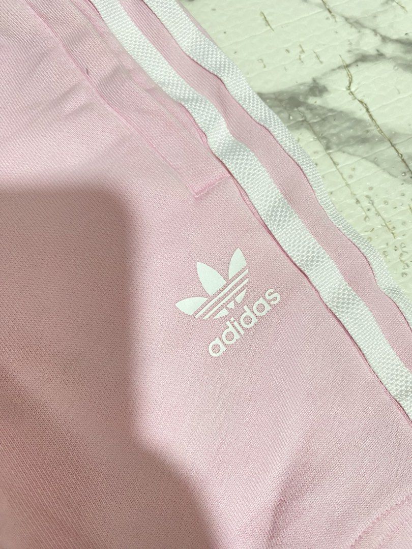 Adidas Pink Shorts with White Stripes (Category: Babies & Kids Fashion) located in Valenzuela. Submitted by acandychin (Listing ID 1451697972, Image 3). Description: - Pink Adidas shorts for kids - Classic white stripes on the sides - Drawstring waist for a comfortable fit - Adidas logo on the leg - Made from a soft cotton blend - Ideal for playtime and lounging 4-5y.