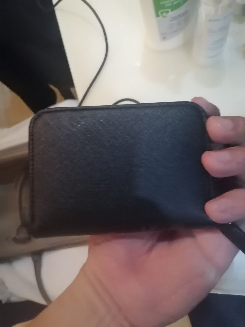 Agnes b. Black Leather Coin Pouch (Category: Purses & Pouches) located in Pasay City. Submitted by 22spc (Listing ID 1451628507, Image 2). Description: - Authentic Agnes b. coin pouch - Material: Genuine black leather - Closure: Secure zip - Interior: Multiple compartments for organization - Includes: Original box and tags - Original Retail Price: ¥7,598.