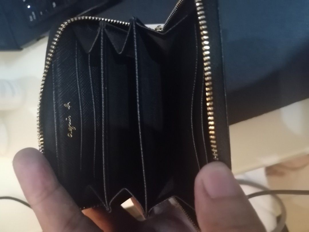 Agnes b. Black Leather Coin Pouch (Category: Purses & Pouches) located in Pasay City. Submitted by 22spc (Listing ID 1451628507, Image 3). Description: - Authentic Agnes b. coin pouch - Material: Genuine black leather - Closure: Secure zip - Interior: Multiple compartments for organization - Includes: Original box and tags - Original Retail Price: ¥7,598.