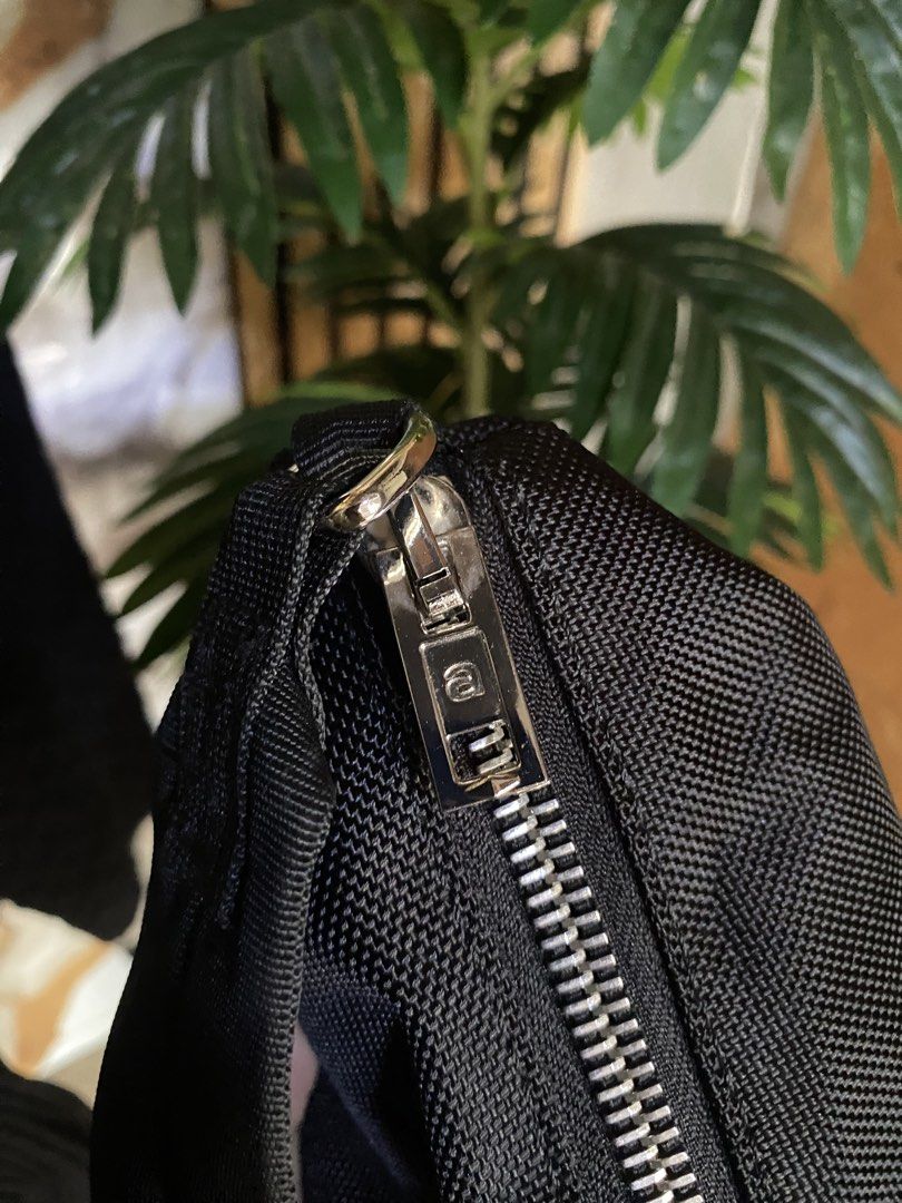 Alexander Wang Black Nylon Shoulder Bag (Category: Luxury Bags & Wallets) located in Manila. Submitted by ivy_ives (Listing ID 1451592459, Image 3). Description: - Brand: Alexander Wang - Material: Black Nylon - Closure: Zip - Interior: Pockets, repeating brand name lining - Hardware: Silver - Style: Clean, classic, great for everyday use.