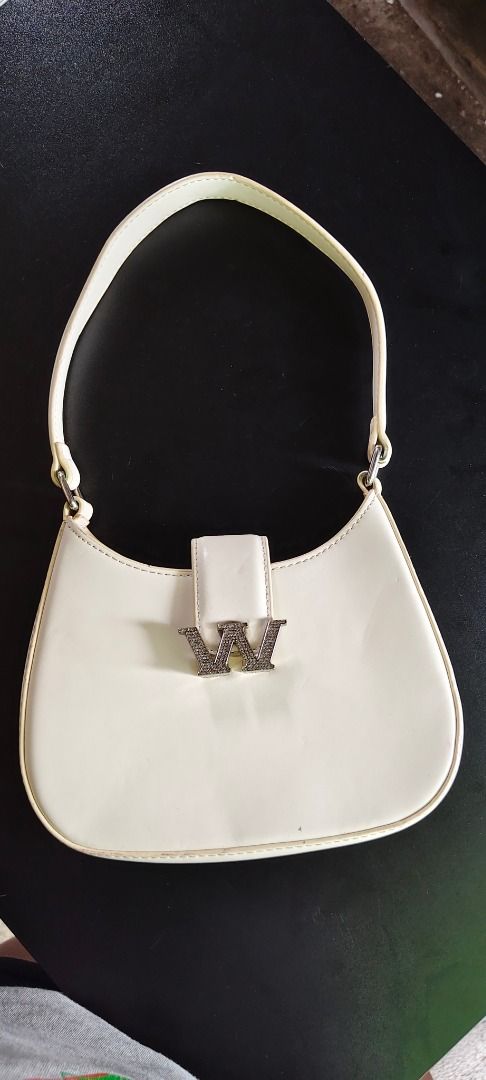 Alexander Wang W Legacy Small Hobo Bag (Category: Luxury Bags & Wallets) located in Legazpi City. Submitted by roxy420 (Listing ID 1451558585, Image 2). Description: - Alexander Wang off-white hobo bag - Features iconic 'W' logo hardware with crystals - Small size, perfect for essentials - Made in Italy.