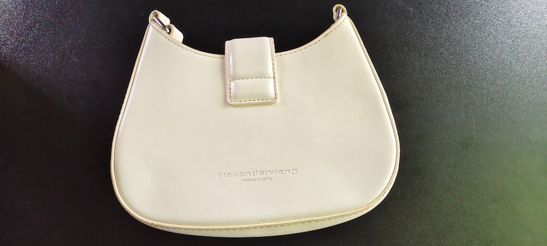 Alexander Wang W Legacy Small Hobo Bag (Category: Luxury Bags & Wallets) located in Legazpi City. Submitted by roxy420 (Listing ID 1451558585, Image 3). Description: - Alexander Wang off-white hobo bag - Features iconic 'W' logo hardware with crystals - Small size, perfect for essentials - Made in Italy.