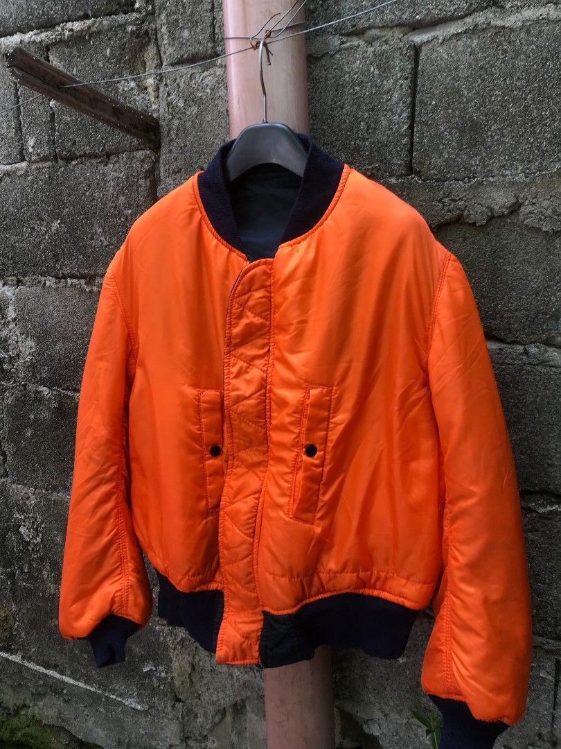 ALPHA INDUSTRIES BOMBER JACKET REVERSIBLE (Category: Coats, Jackets and Outerwear) located in Naga. Submitted by black-market00 (Listing ID 1451680095, Image 2). Description: WIDTH 23 LENGHT 26 GOOD AS NEW.