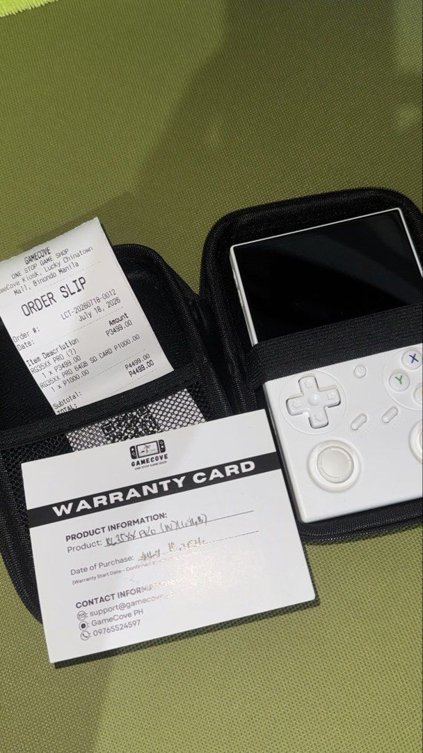 Anbernic RG35XXPro - KNULLI OS Game Console (Category: Others) located in Pasig City. Submitted by goodbuy_02 (Listing ID 1451680233, Image 1). Description: - Anbernic RG35XX Pro Handheld Console (White) - Includes original box - Protective bag included - with warranty card - 64GB SD card - Purchased on July 18, 2023 - All items shown in photos.