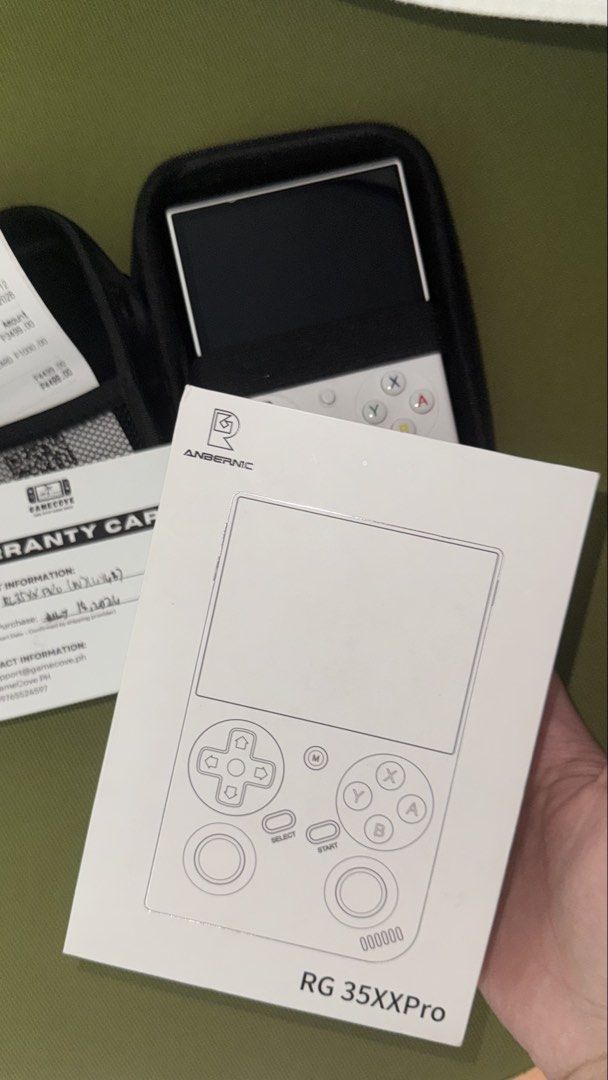 Anbernic RG35XXPro - KNULLI OS Game Console (Category: Others) located in Pasig City. Submitted by goodbuy_02 (Listing ID 1451680233, Image 2). Description: - Anbernic RG35XX Pro Handheld Console (White) - Includes original box - Protective bag included - with warranty card - 64GB SD card - Purchased on July 18, 2023 - All items shown in photos.