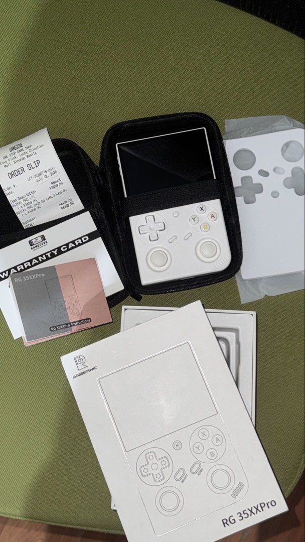 Anbernic RG35XXPro - KNULLI OS Game Console (Category: Others) located in Pasig City. Submitted by goodbuy_02 (Listing ID 1451680233, Image 3). Description: - Anbernic RG35XX Pro Handheld Console (White) - Includes original box - Protective bag included - with warranty card - 64GB SD card - Purchased on July 18, 2023 - All items shown in photos.
