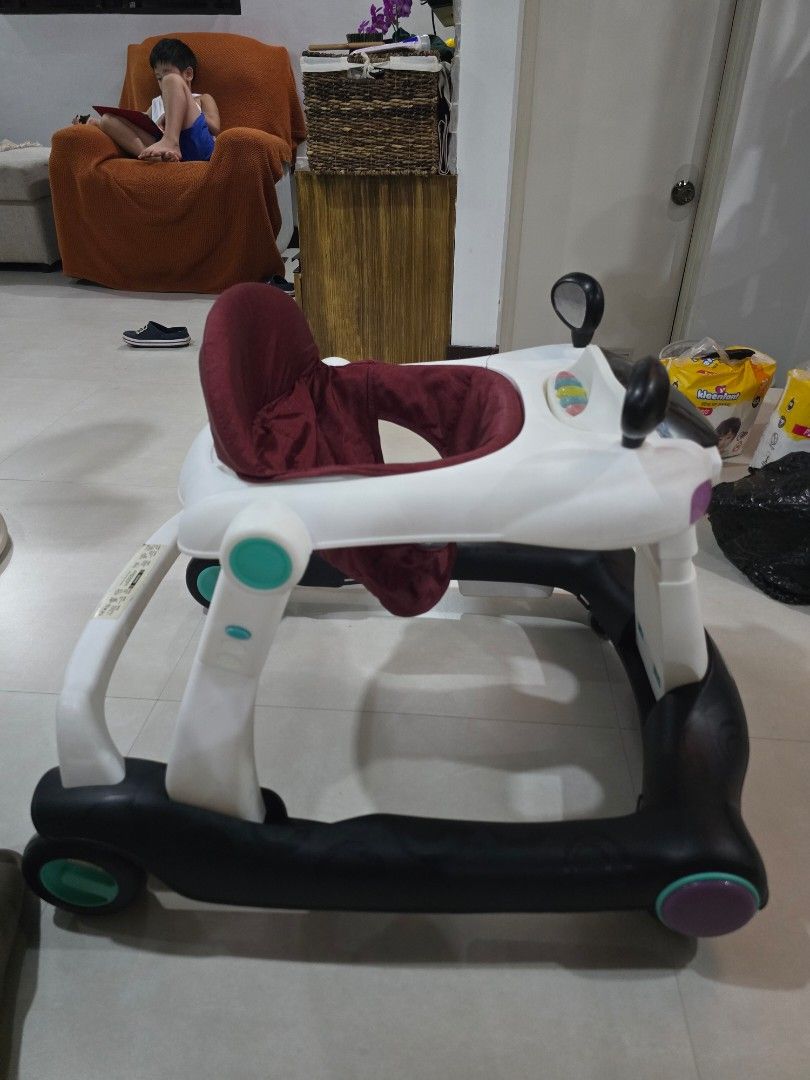 Apruva Baby Walker with Seat (Category: Other Kids Furniture) located in Muntinlupa City. Submitted by declutteringmoomah (Listing ID 1451623577, Image 2). Description: - Apruva Baby Walker - Comfortable padded seat - Sturdy frame with wheels for easy movement - Playful and engaging design - Aids in learning to walk - Minor scuffs from normal use.
