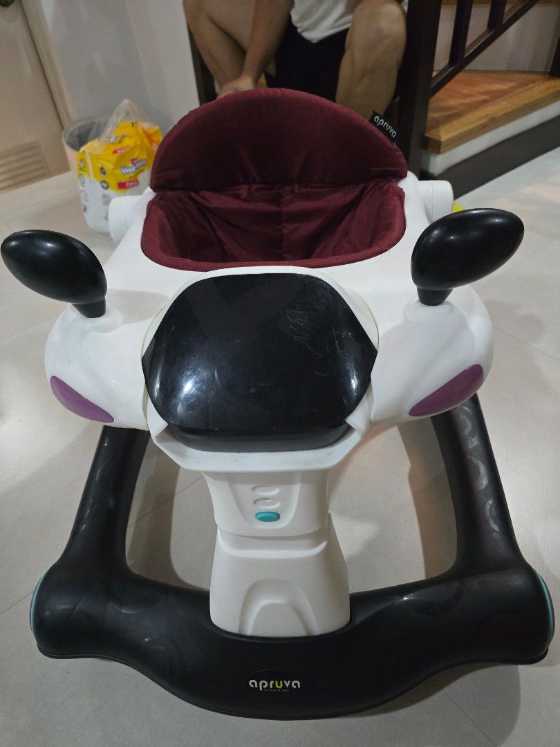 Apruva Baby Walker with Seat (Category: Other Kids Furniture) located in Muntinlupa City. Submitted by declutteringmoomah (Listing ID 1451623577, Image 3). Description: - Apruva Baby Walker - Comfortable padded seat - Sturdy frame with wheels for easy movement - Playful and engaging design - Aids in learning to walk - Minor scuffs from normal use.