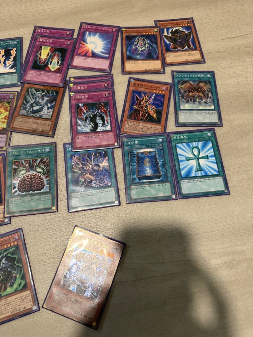 Assorted characters (Category: Raw Cards) located in Singapore. Submitted by ploopploop5 (Listing ID 1451643721, Image 3). Description: Large collection of Japanese Yu-Gi-Oh cards featuring various iconic monsters, spells, and traps. This bulk lot includes several holographic cards and classic staples from different sets. Great variety for fans of the original series and beyond. Can be sold individually .