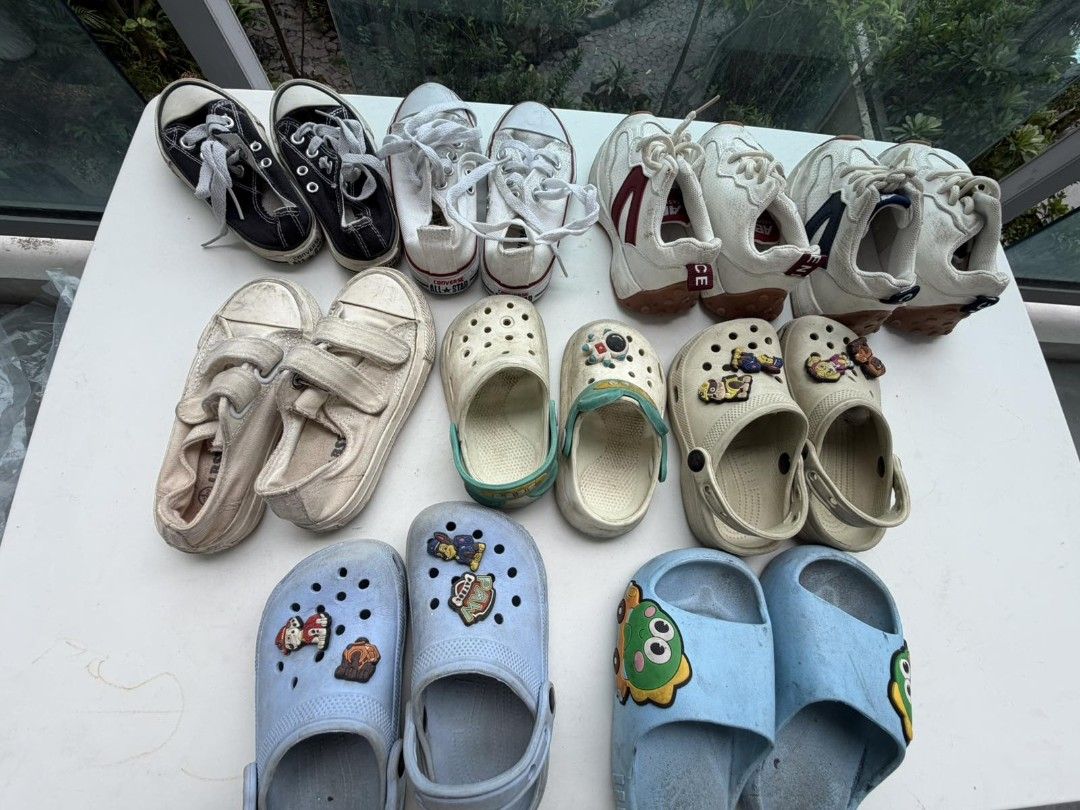 Assorted Kids Shoes - Converse, Crocs, Sneakers (Category: Babies & Kids Fashion) located in Mandaluyong City. Submitted by derekalava (Listing ID 1451685856, Image 1). Description: - for saleBundle of kids' shoes see pics for the condition get all with free socks - Includes black & white Converse sneakers - White canvas sneakers with velcro straps - Various pairs of Crocs-style clogs - Some clogs feature fun character charms - Perfect for everyd