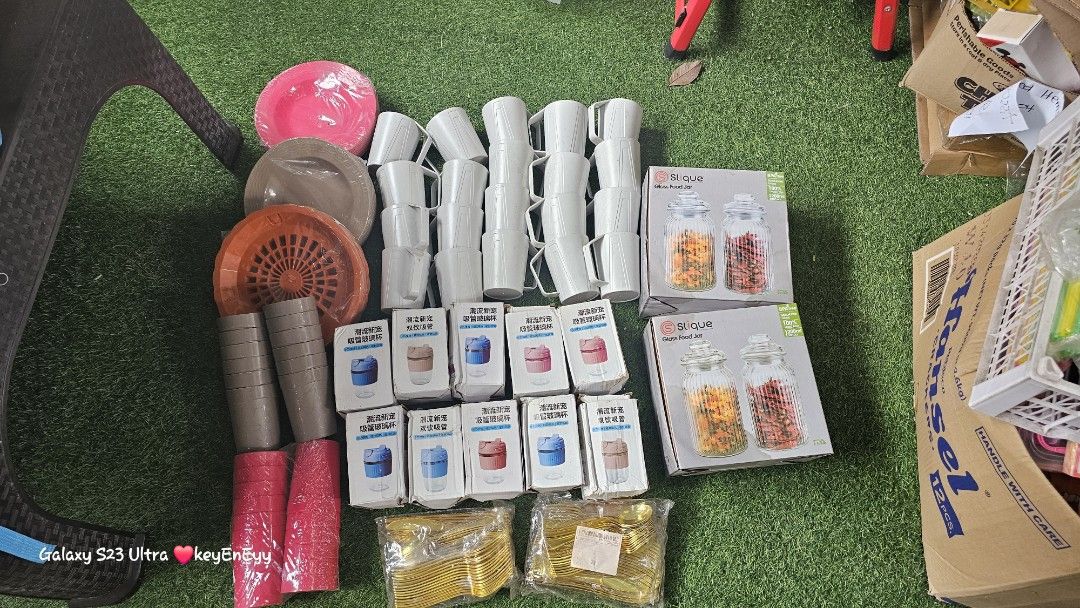 Assorted Kitchenware: Mugs, Plates, Containers, and More (Category: Other Kitchenware & Tableware) located in Caloocan City. Submitted by auntieeyy (Listing ID 1451691135, Image 1). Description: - Bundle of kitchen essentials - Includes: white mugs, brown and pink plates, grey and pink cups - Also features: 2 boxes of clear storage containers with orange and red lids - Additional small blue and pink organizing boxes - Ideal for kitchen organizati