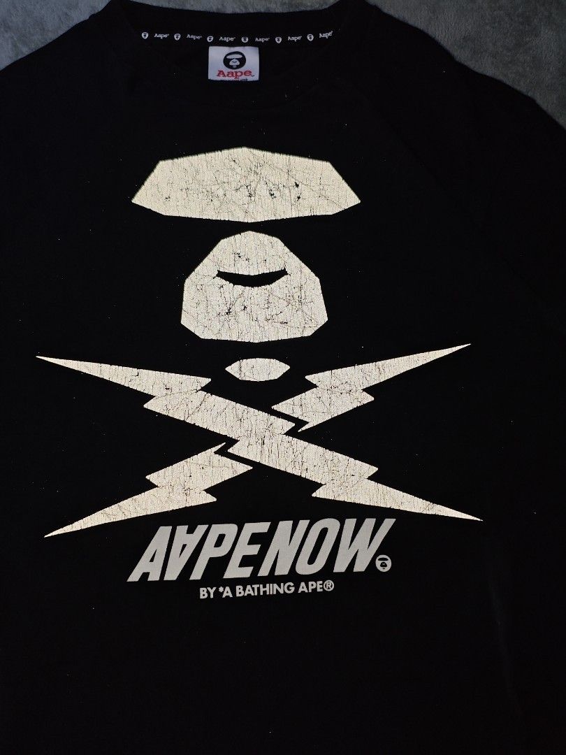 Authentic Aape Thunder Reflectorized Logo Black Tee (Authentic/Legit) (Category: Tshirts & Polo Shirts ) located in San Pedro. Submitted by chronothrift (Listing ID 1451546928, Image 3). Description: - Size: Medium (W20" x 27"L) - Condition: 9/10 - Color Rate: 8.5/10 - Flaws: Crack Prints MOD: J&T Express / Lalamove / Meet MOP: Gcash / Bank Transfer.