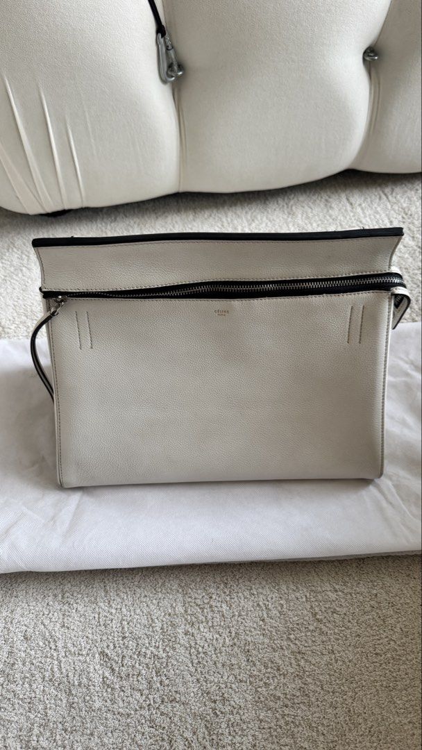 Authentic White Celine Edge Leather Tote Bag (Category: Luxury Bags & Wallets) located in Taguig. Submitted by annpo27 (Listing ID 1451694995, Image 1). Description: - Authentic Celine Edge tote in crisp white leather. - Secure zip closure on top. - Features multiple interior compartments for organization. - Interior shows minor signs of use (small marks). - Comes with dust bag. - An ideal and stylish everyday carry-all. - No damages, freshly con