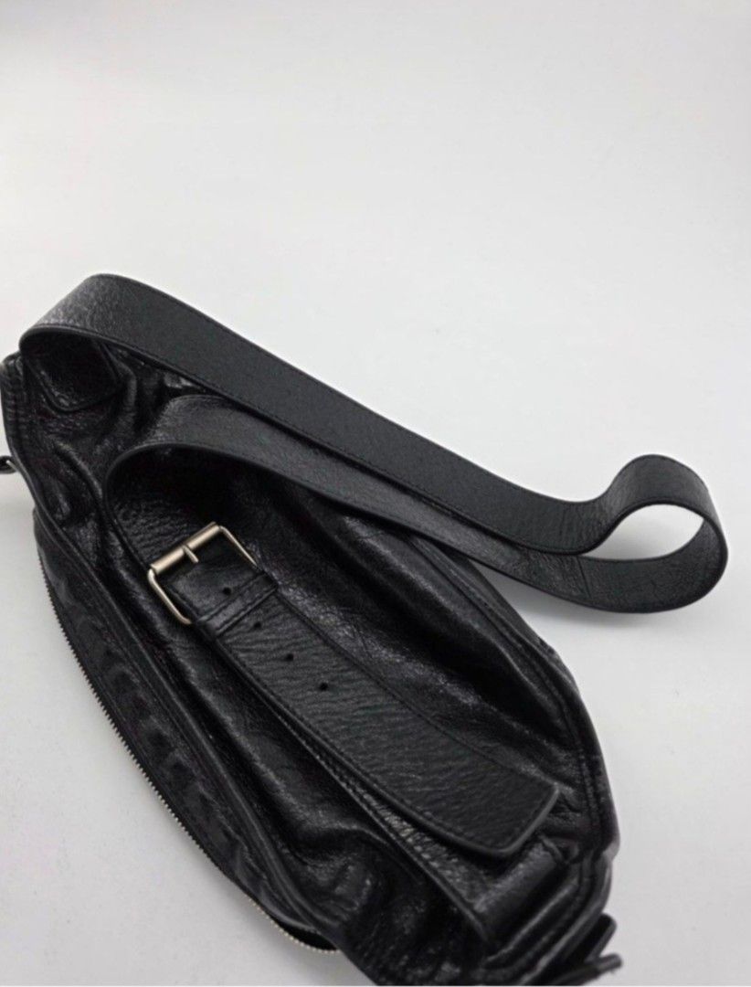 Balenciaga Black Leather Belt Bag (Category: Luxury Bags & Wallets) located in Quezon City. Submitted by deng43763 (Listing ID 1451650291, Image 3). Description: - Authentic Balenciaga black leather belt bag - Multiple zippered compartments for organization - Adjustable strap with buckle closure - Distinctive slightly crinkled leather texture - Silver-tone hardware - Comes with original dust bag.