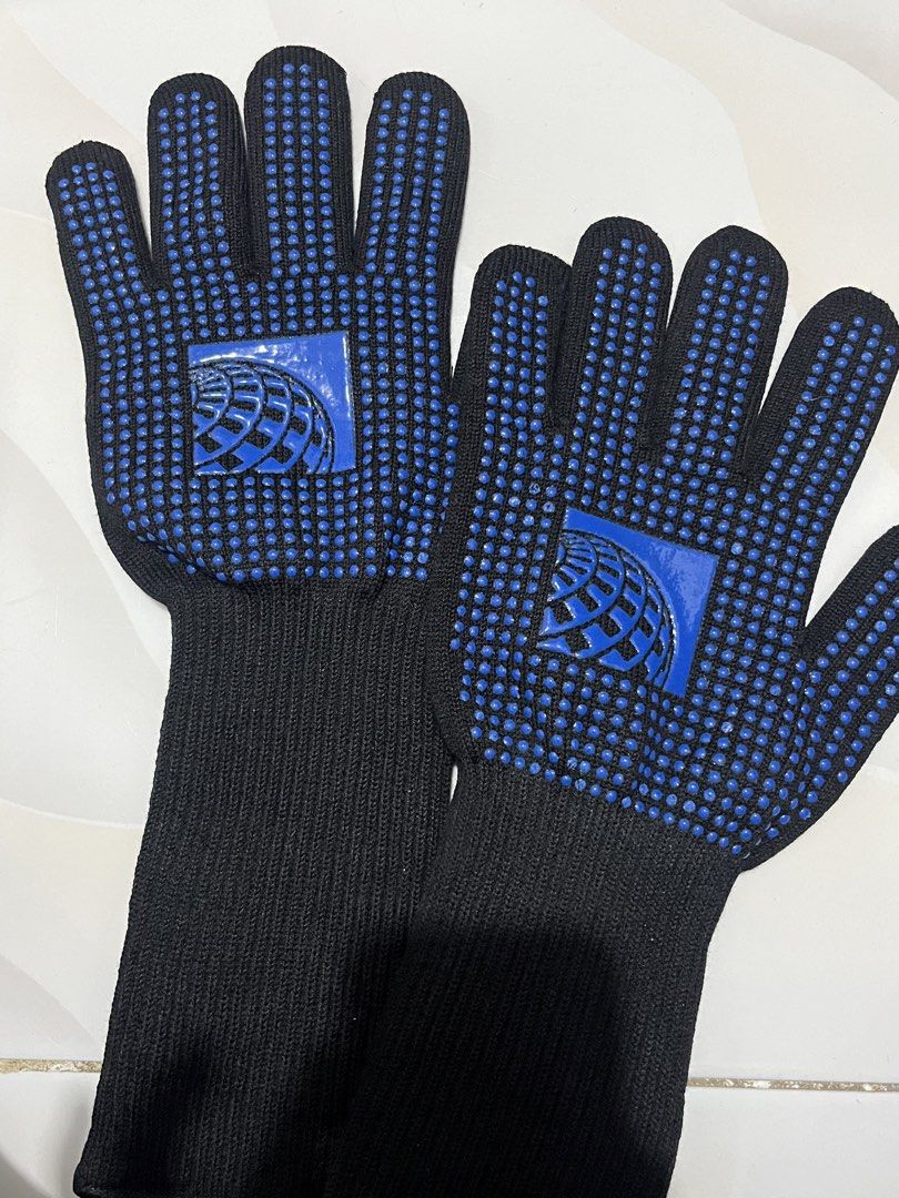 Black and Blue Grip Heat Gloves (Category: Gloves) located in Muntinlupa City. Submitted by sgvcreates (Listing ID 1451620612, Image 1). Description: - Black gloves with all-over blue grip dots on palm and fingers. - Features a blue logo on the back of the hand. - Ribbed cuffs extend up the forearm for a snug fit. - Perfect for handling items or for various work applications..