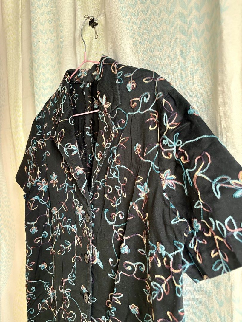 Black Embroidered Short Sleeve Button-Up Shirt (Category: Shirts) located in Adams. Submitted by eggs.sam.cheese (Listing ID 1451682336, Image 2). Description: - Black short sleeve shirt - Button-up front with collar - Colorful floral embroidery (blue, pink, yellow) - Relaxed fit - Ideal for casual wear or layering - Easy to style.