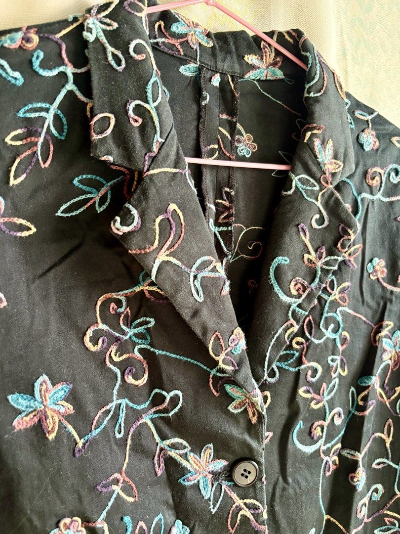 Black Embroidered Short Sleeve Button-Up Shirt (Category: Shirts) located in Adams. Submitted by eggs.sam.cheese (Listing ID 1451682336, Image 3). Description: - Black short sleeve shirt - Button-up front with collar - Colorful floral embroidery (blue, pink, yellow) - Relaxed fit - Ideal for casual wear or layering - Easy to style.