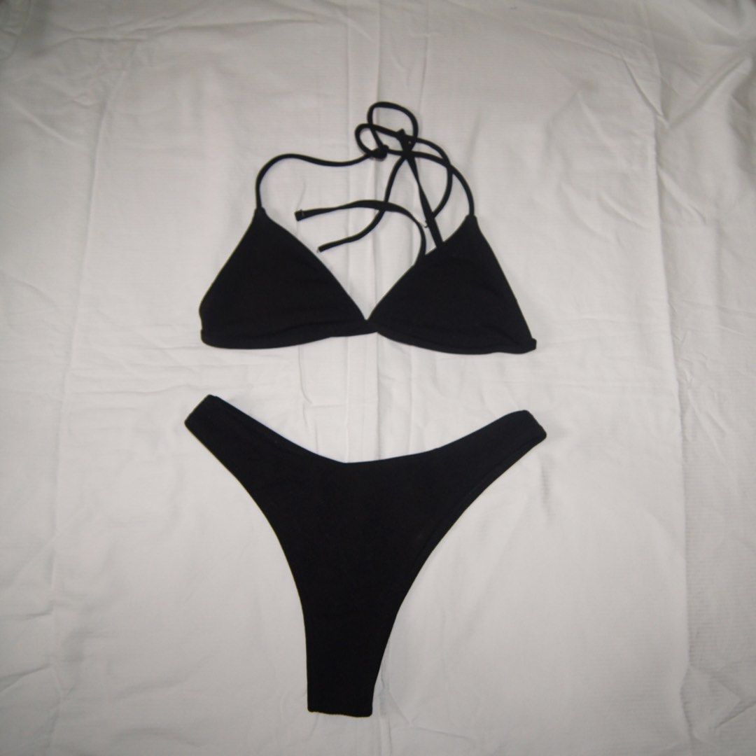 Black Triangle Bikini Set (Category: Bikinis & Swimsuits) located in Iloilo. Submitted by 080789 (Listing ID 1451676139, Image 1). Description: - Classic black bikini set - Triangle top with adjustable tie straps - High-cut bottoms - Simple and versatile design - Ideal for beach or pool days.