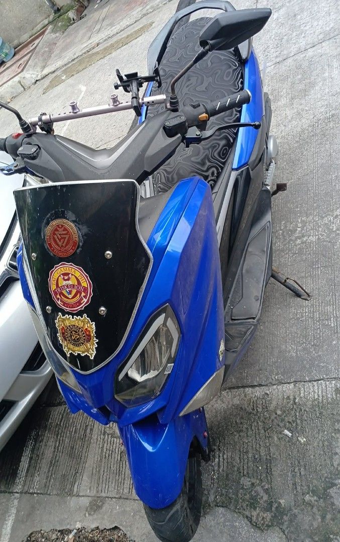 Blue Scooter Motorcycle with Windshield and Stickers (Category: Skates, Rollerblades & Scooters) located in Manila. Submitted by max.007 (Listing ID 1451697249, Image 1). Description: FOR SALE EASY RIDE 150N QUICK DETAILS 150 CC ENGINE 50K + ODO SUBOK SA LONG RIDE REGISTERED UNTIL FEBRUARY 2027 COMPLETE DOCUMENTS OPEN DEED OF SALE VALID ID NG OWNER WITH 3 SIGNATURE FIRST OWNER ANG NAG BEBENTA ORIGINAL OR ORIGINAL PLATE FROM LTO XEROX CR PERO UNLI