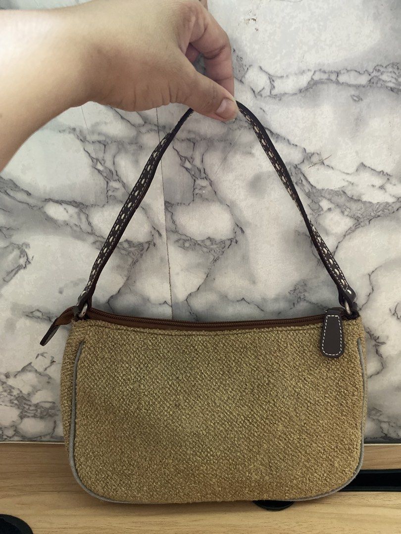 Brown Tweed Shoulder Bag with Leather Trim (Category: Shoulder Bags) located in Caloocan City. Submitted by izzyjelly (Listing ID 1451626140, Image 2). Description: Cute little shoulder bag. Brown tweed material with brown leather trim. Zipper closure. Inside has a zippered pocket. Small and compact, great for essentials. Perfect size for a quick outing..