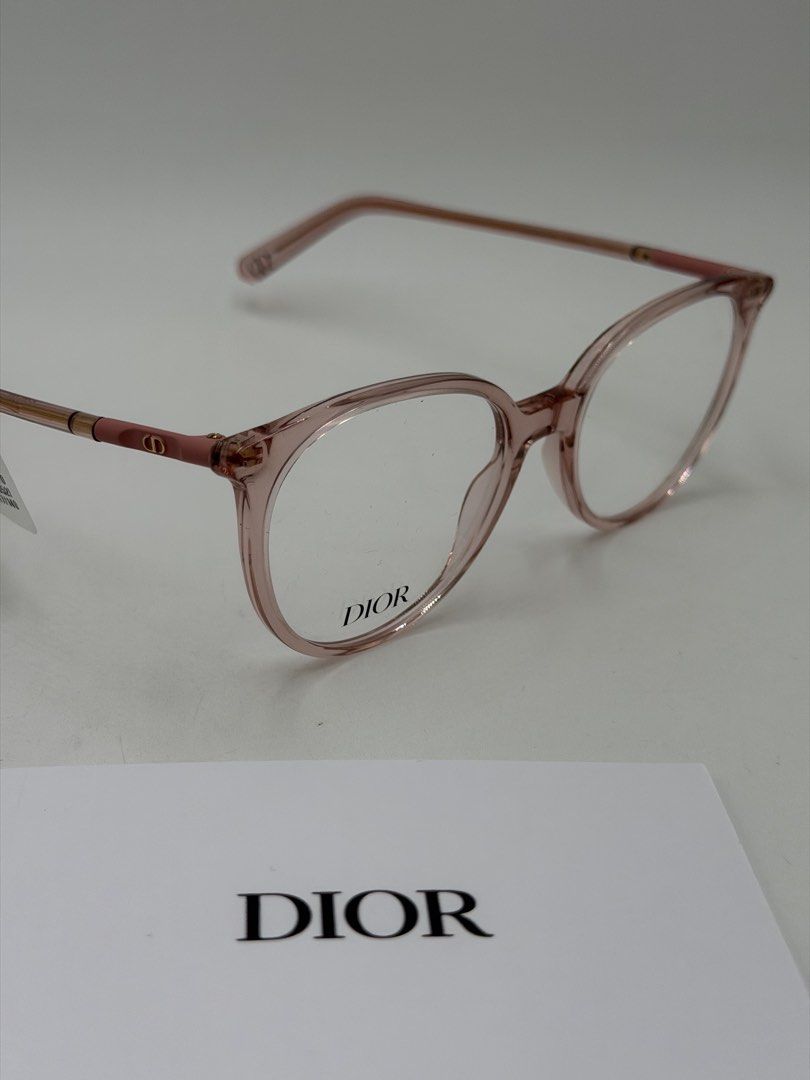 Christian Dior Mini CD O B1I Eyeglasses (Category: Luxury Accessories) located in Quezon City. Submitted by _cmluxephilippines (Listing ID 1451695557, Image 3). Description: Christian Dior Mini CD O B1I Eyeglasses.Product OverviewBrand: Christian DiorModel Line: Mini CDColor Code: 4100 / 074 (Shiny Transparent Rose / Pink)Design Features: The frames feature a rounded acetate silhouette with signature metal hinges adorned with a subtle gold-finish