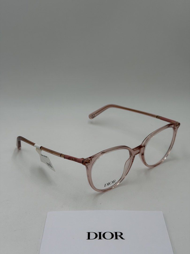 Christian Dior Mini CD O B1I Eyeglasses (Category: Luxury Accessories) located in Quezon City. Submitted by _cmluxephilippines (Listing ID 1451695557, Image 2). Description: Christian Dior Mini CD O B1I Eyeglasses.Product OverviewBrand: Christian DiorModel Line: Mini CDColor Code: 4100 / 074 (Shiny Transparent Rose / Pink)Design Features: The frames feature a rounded acetate silhouette with signature metal hinges adorned with a subtle gold-finish