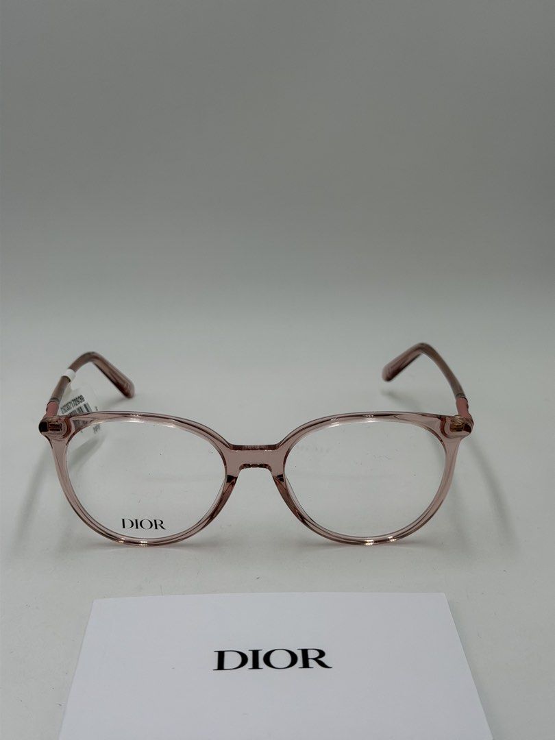 Christian Dior Mini CD O B1I Eyeglasses (Category: Luxury Accessories) located in Quezon City. Submitted by _cmluxephilippines (Listing ID 1451695557, Image 1). Description: Christian Dior Mini CD O B1I Eyeglasses.Product OverviewBrand: Christian DiorModel Line: Mini CDColor Code: 4100 / 074 (Shiny Transparent Rose / Pink)Design Features: The frames feature a rounded acetate silhouette with signature metal hinges adorned with a subtle gold-finish