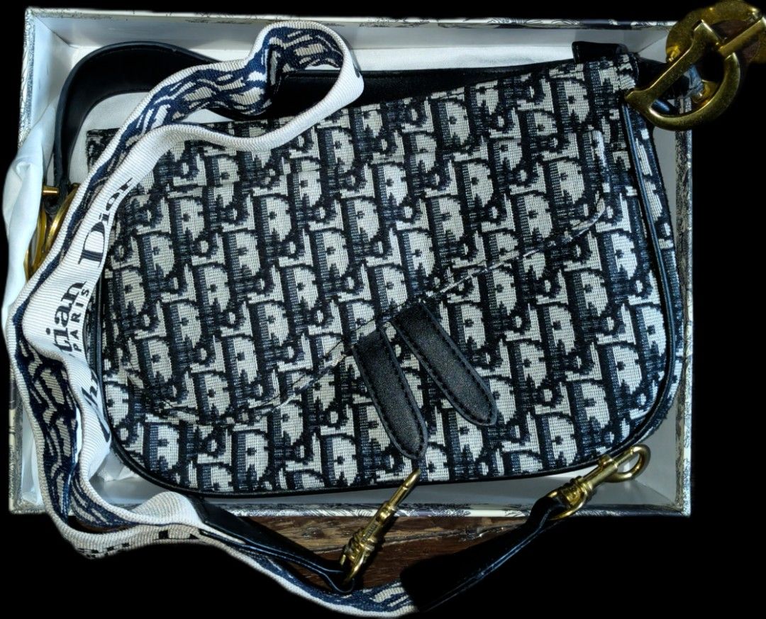 Christian Dior saddle bag oblique canvas (Category: Luxury Bags & Wallets) located in Quezon City. Submitted by morningstar_52 (Listing ID 1451559640, Image 1). Description: - once used - may unting punit/sira sa may zipper - Iconic Oblique canvas - Detachable strap with 'Christian Dior' lettering - Gold-tone hardware - Includes original Dior box and dust bag - A classic addition to any collection.