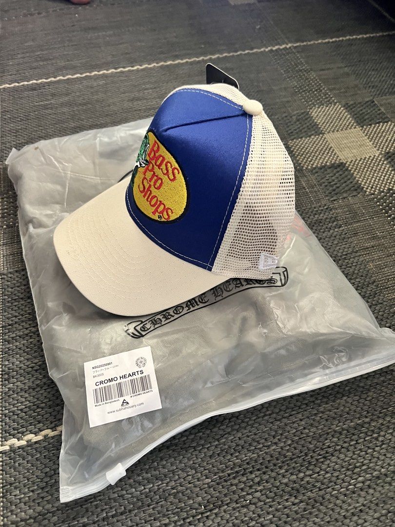 Chrome Hearts x Bass Pro Shops Trucker Hat (Category: Caps & Hats) located in Manila. Submitted by zennocap (Listing ID 1451520833, Image 1). Description: - Authentic Chrome Hearts x Bass Pro Shops collaboration trucker hat - Classic blue and white colorway - Breathable mesh back for comfort - Comes with original packaging - Perfect for collectors and fans of both brands.