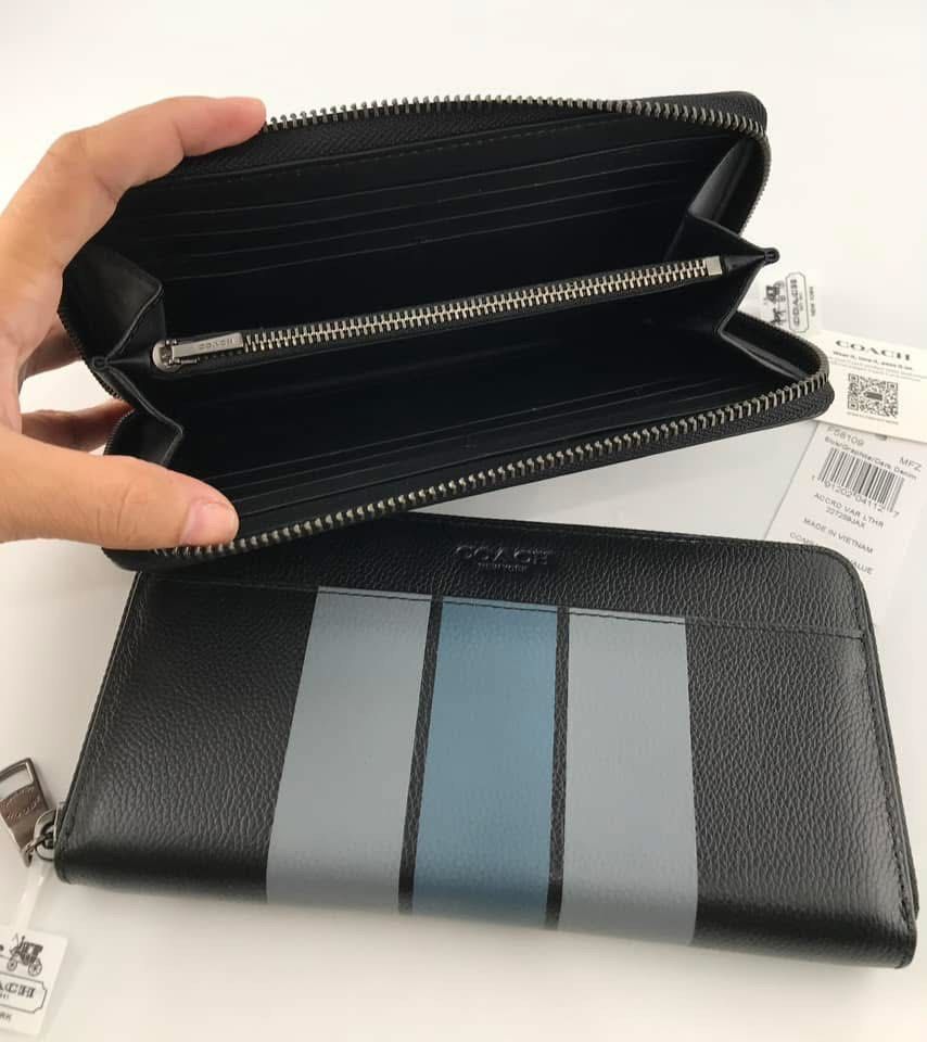 Coach Accord Zip Wallet Black Stripe (Category: Wallets & Card Holders) located in Caloocan City. Submitted by brandeditemsph (Listing ID 1451526849, Image 3). Description: - Coach Accord Zip Wallet - Color: Black with grey and blue stripe detail - Interior: Plenty of card slots and compartments - Closure: Zipper - Condition: Brand new with tags.